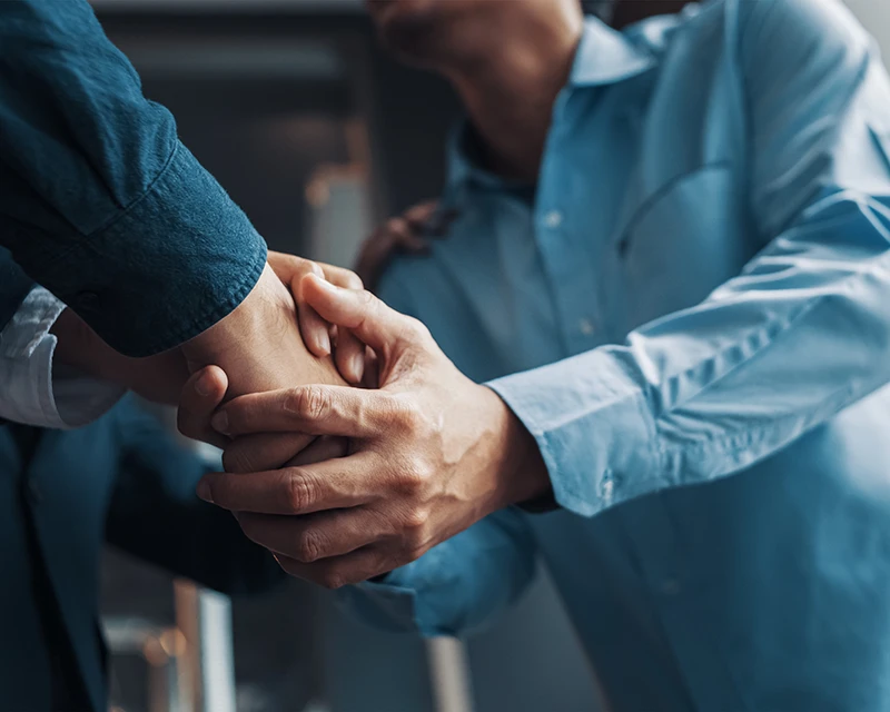 Lawyer shakes hands with a client