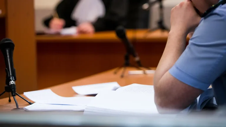 Lawyers listening to the judge in the court room